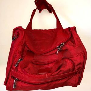 Tumi red travel bag good for a day trip or a weekend away.